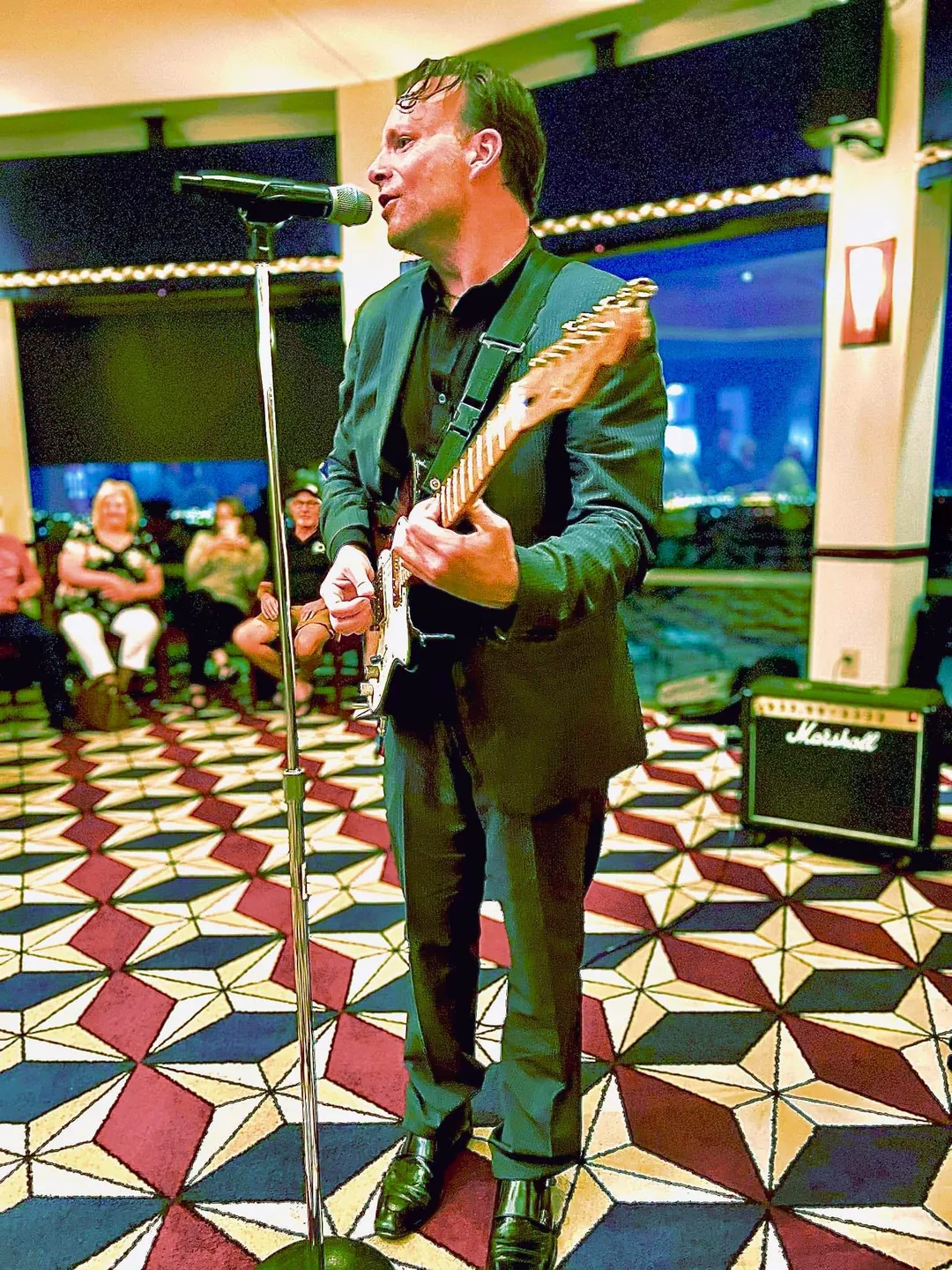 Chris Zemba performing on a ballroom dance floor